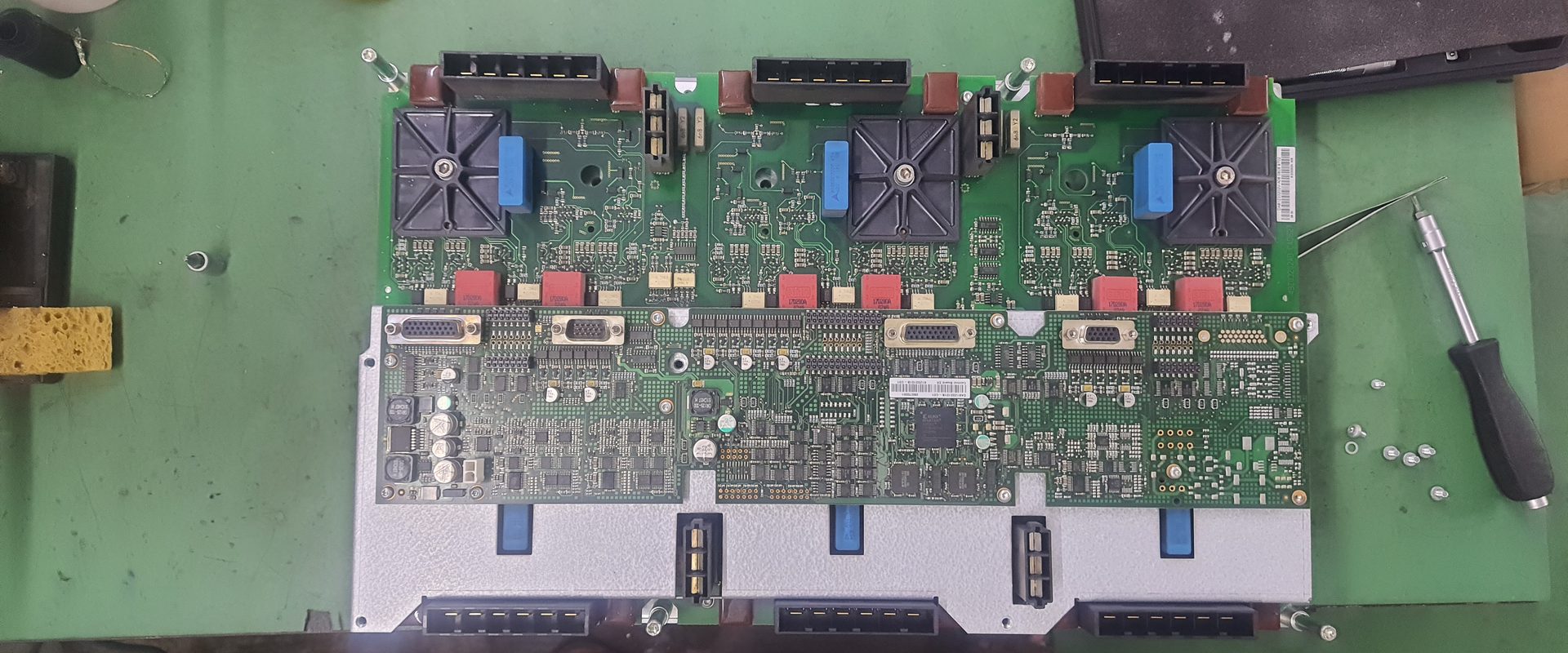 Full industrial drive assembly open for bench repair with tools